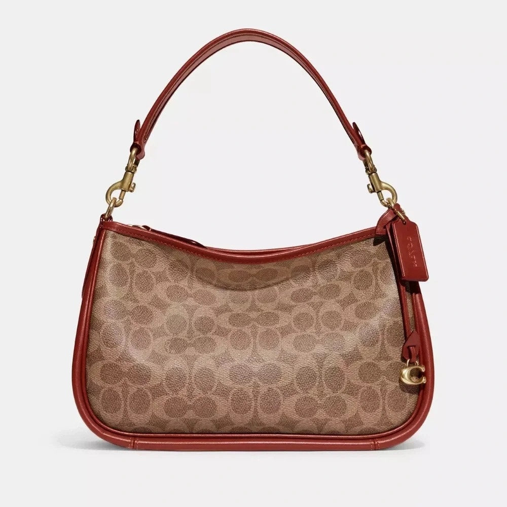 COACH Cary Crossbody Bag In Signature Canvas in Tan/Rust