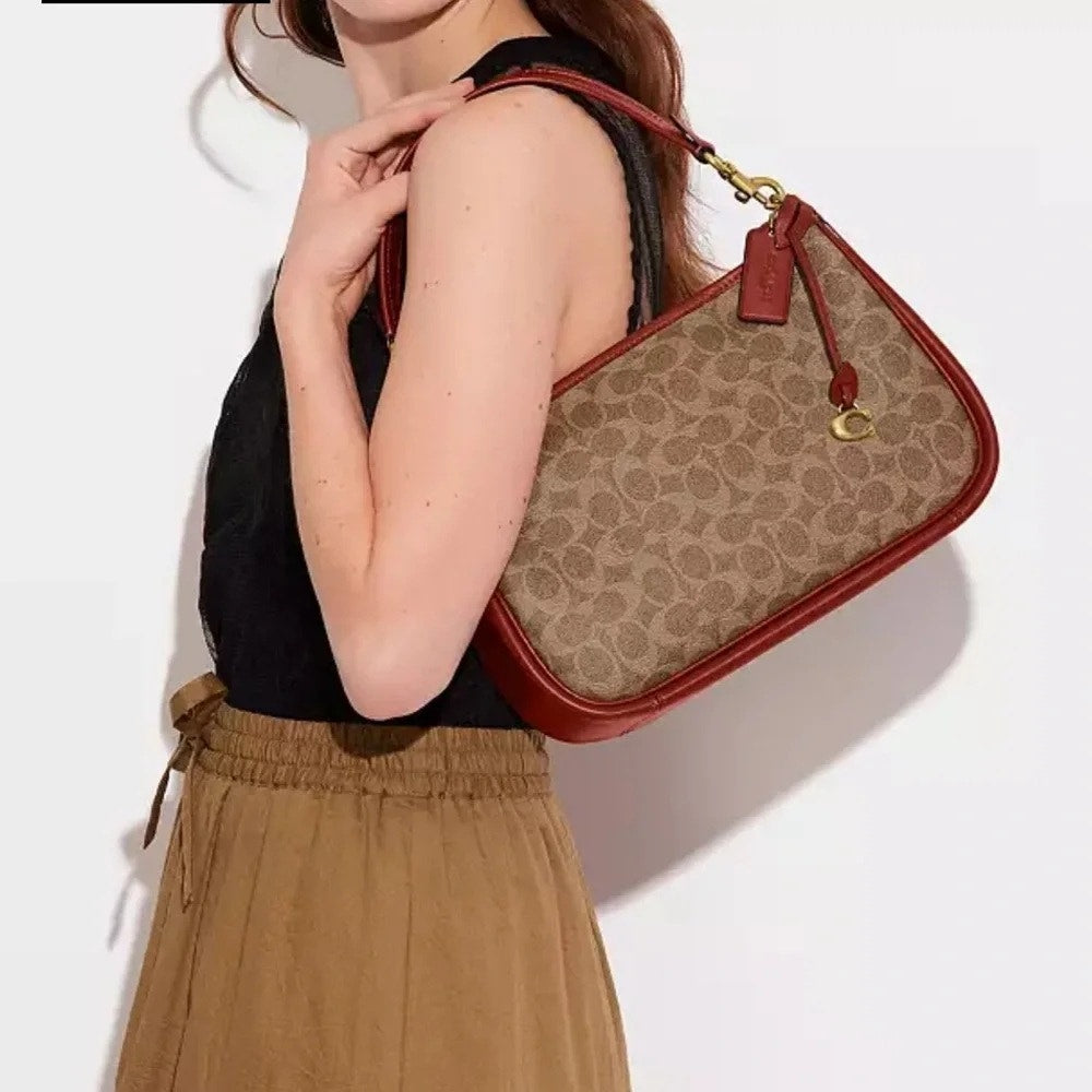 COACH Cary Crossbody Bag In Signature Canvas in Tan/Rust