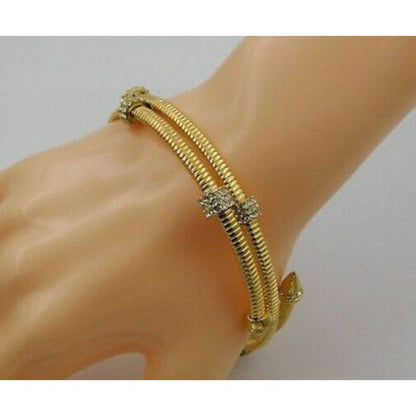 VINCE CAMUTO, Gold Coil Bracelet w/ Arrow & Crysyal Details